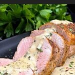 Sliced oven baked pork tenderloin topped with creamy Dijon pan sauce.