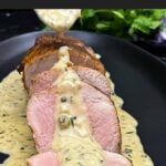 Sliced oven baked pork tenderloin topped with creamy Dijon pan sauce.