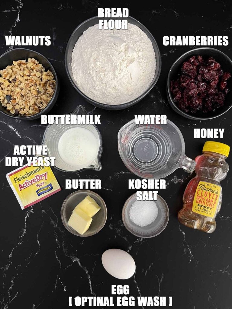 Ingredients for homemade cranberry walnut bread arranged on the counter.