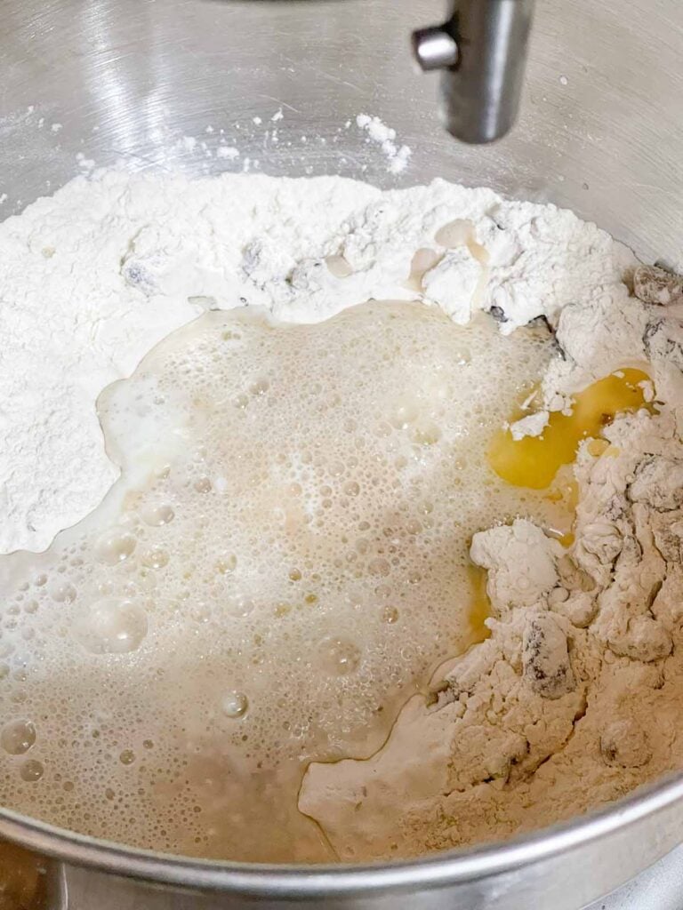 Buttermilk, melted butter, and bloomed yeast mixture added to the dry ingredients.
