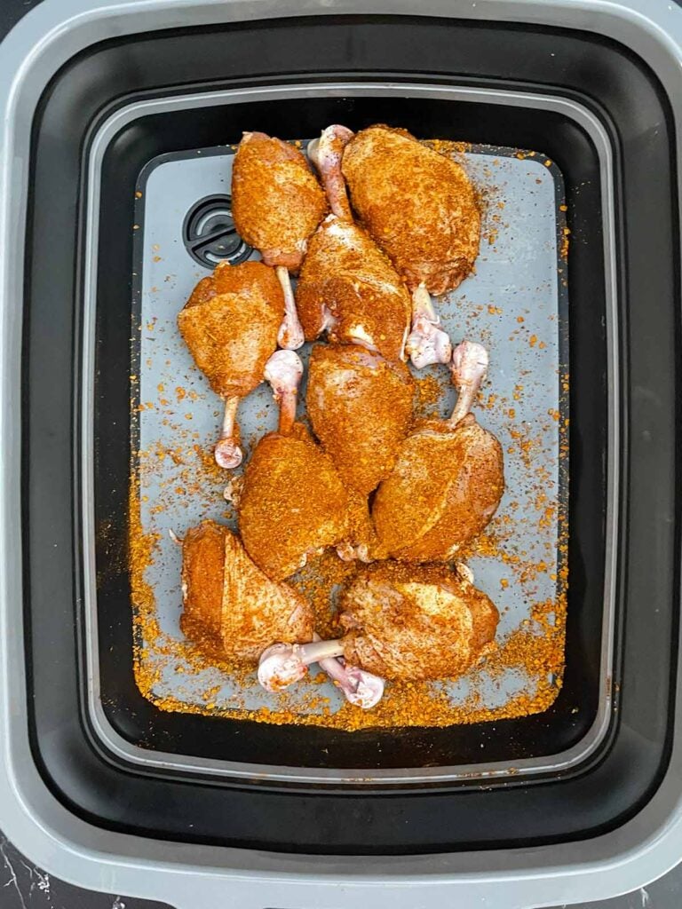 Chicken lollipops generously coated with BBQ dry rub and ready for the smoker.