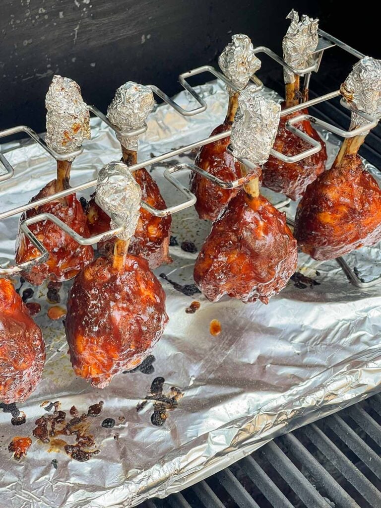Smoked chicken lollipops with a sticky, tacky BBQ glaze.