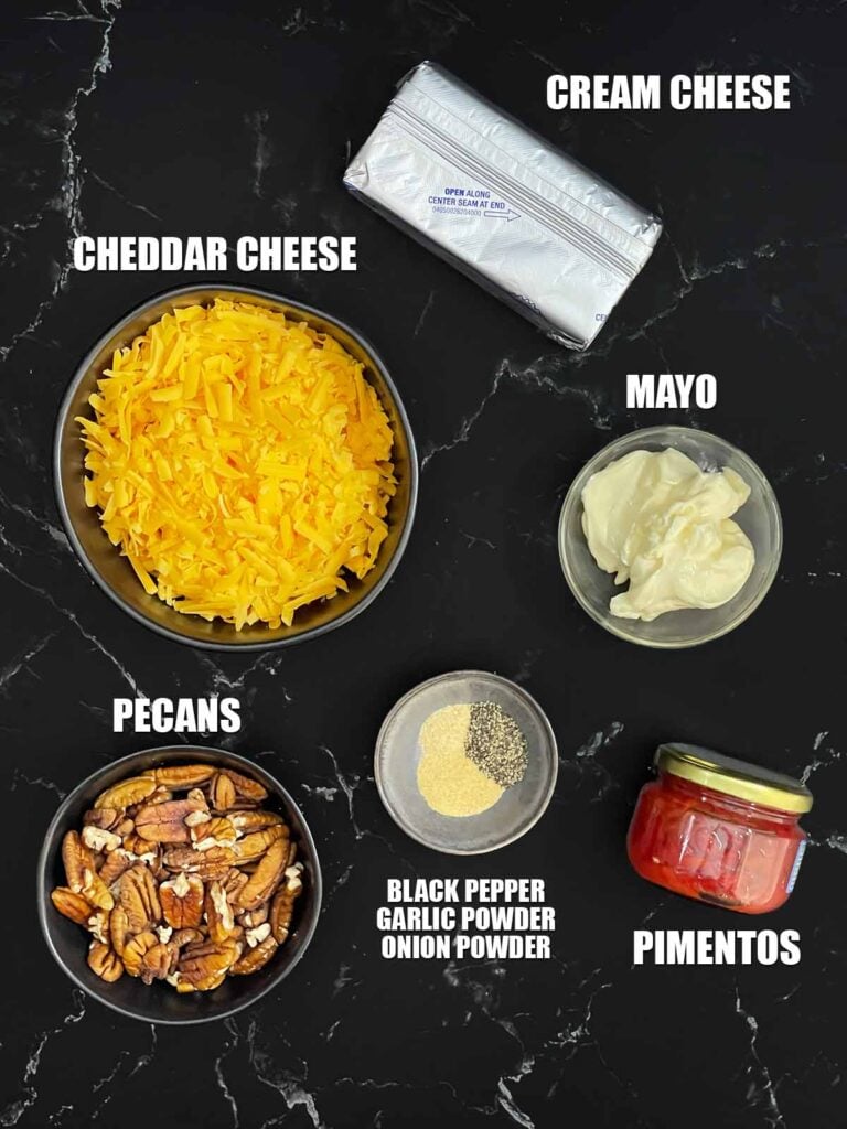 Ingredients for Pimento Cheese Ball, including cream cheese, sharp cheddar, mayonnaise, diced pimentos, seasonings, and chopped pecans.