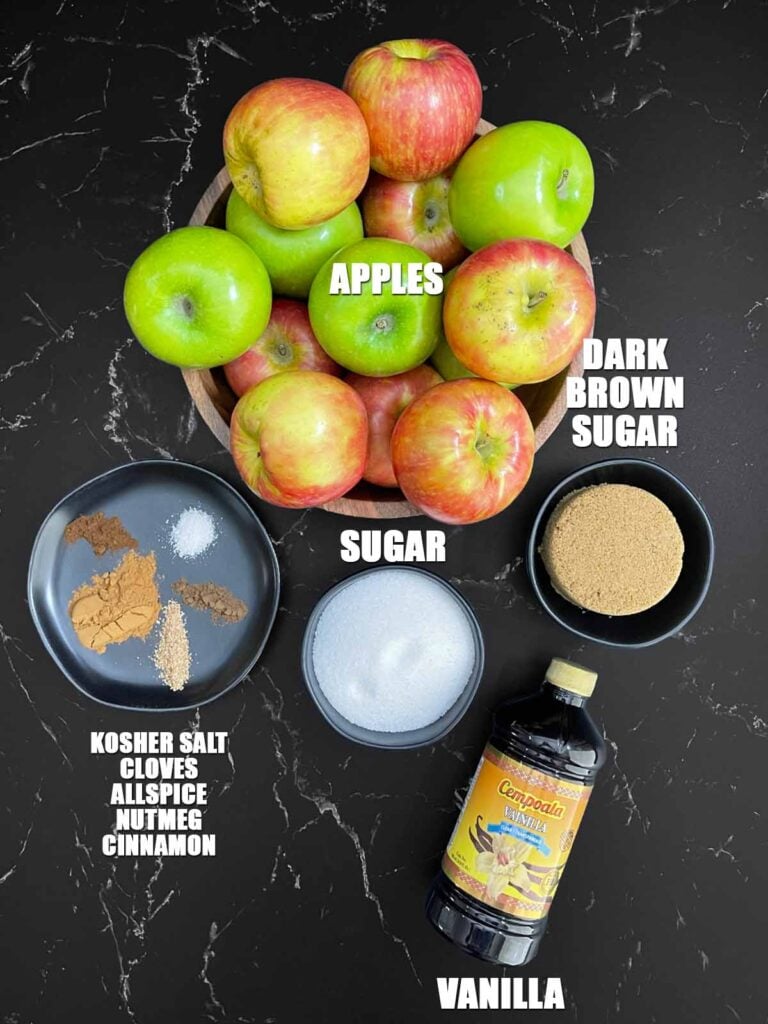 Fresh apples, granulated sugar, brown sugar, cinnamon, nutmeg, cloves, allspice, salt, and vanilla for slow cooker apple butter.