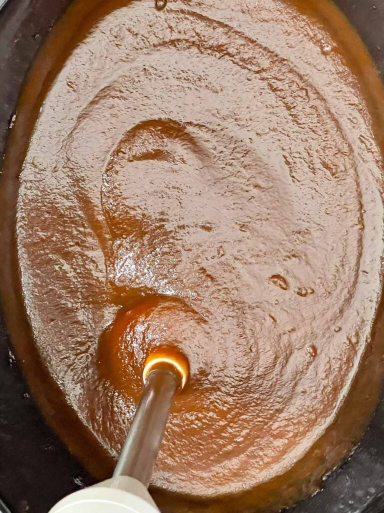 Cooked apples and spices blended in the slow cooker.