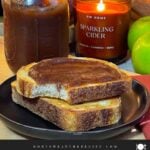 Slow cooker apple butter in a mason jar and smeared on a piece of sourdough toast.